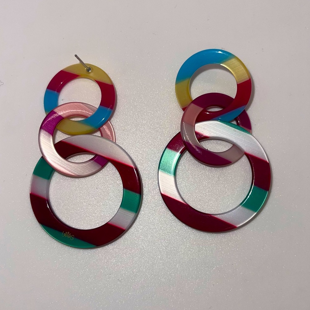 Lele Sadoughi Circus striped multicolored interconnected hoops.